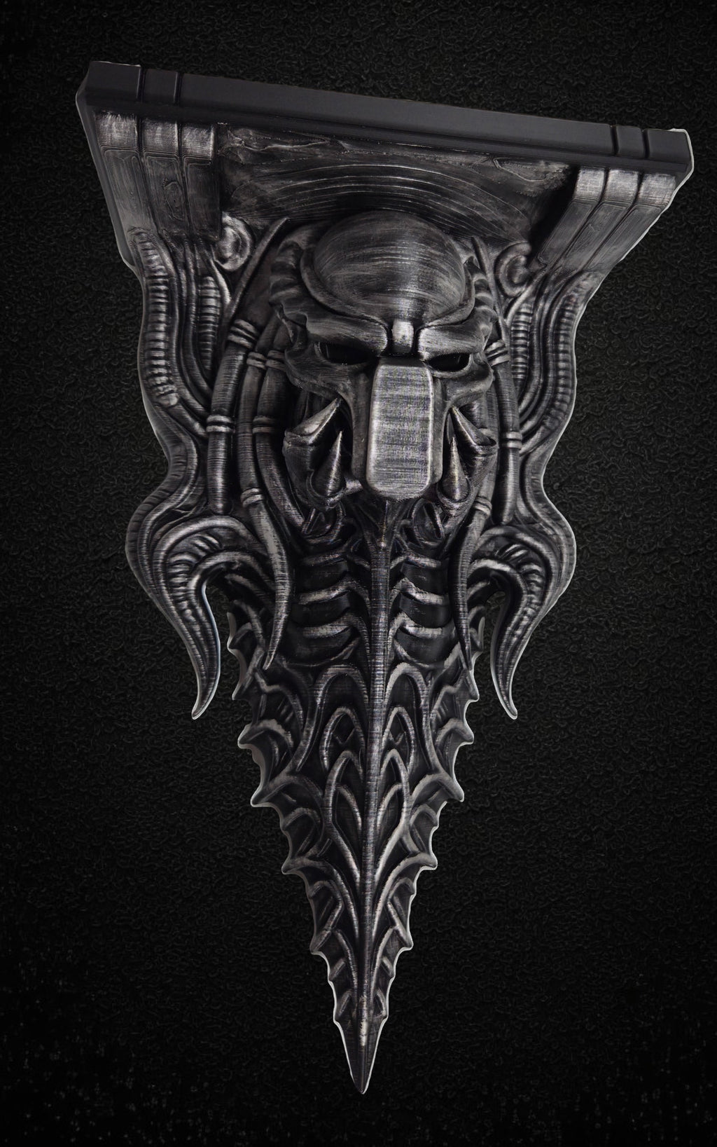 Blackspire Works gothic biomechanical wall shelf featuring a sentinel skull design with metallic hand-finished detail.