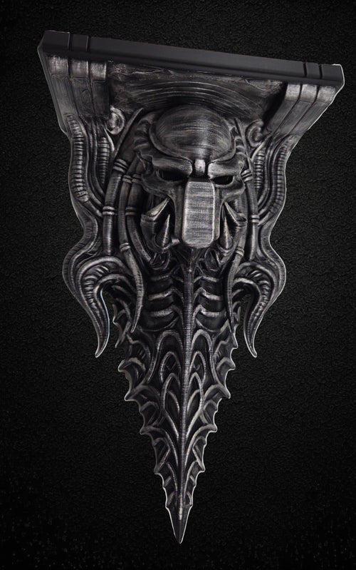 Blackspire Works gothic biomechanical wall shelf featuring a sentinel skull design with metallic hand-finished detail.